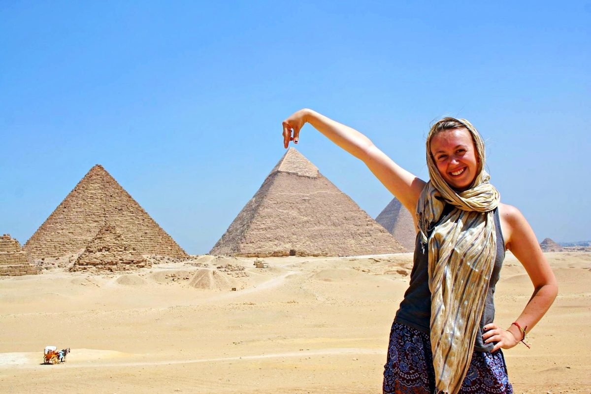 Our licensed Egyptologist guide explaining hieroglyphs to travellers on a private Luxor tour