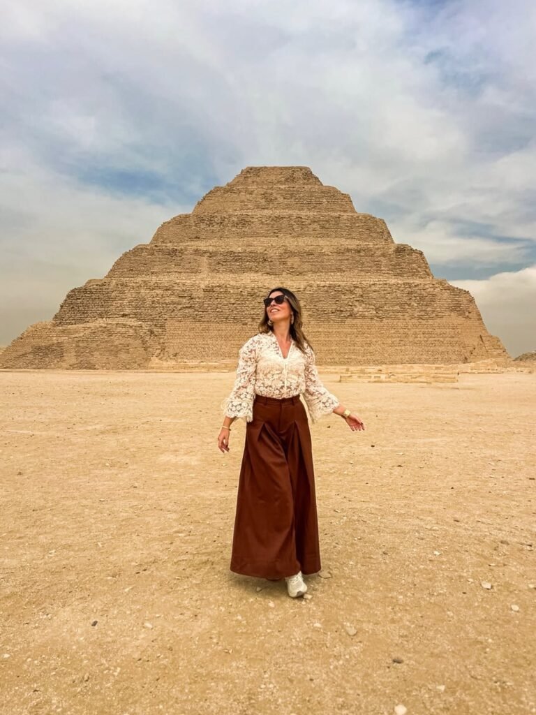 Visitor in front of the Step Pyramid of Djoser at Saqqara