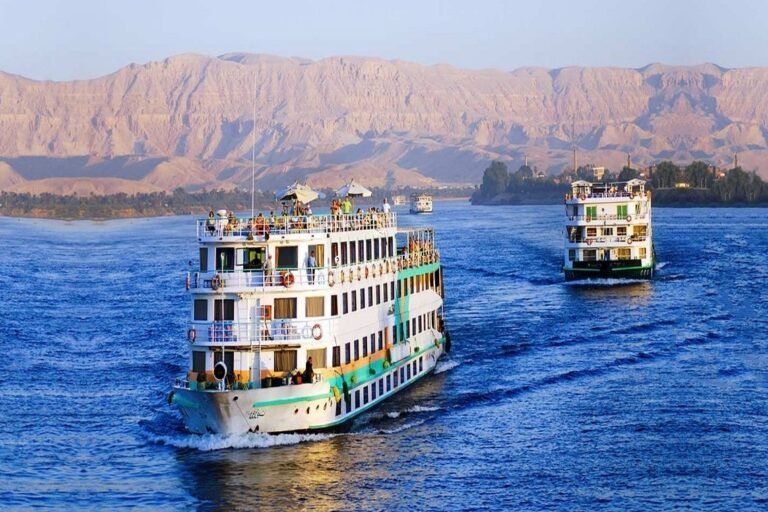 Nile cruise ships sailing past the Theban hills